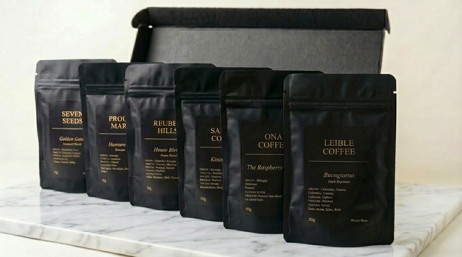 Six GAFFEE 50g packs lined up on white marble